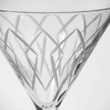 Load image into Gallery viewer, Close-up of a clear glass with geometric etching on a white background