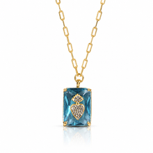 Load image into Gallery viewer, Gold necklace with a blue gemstone pendant on a white background