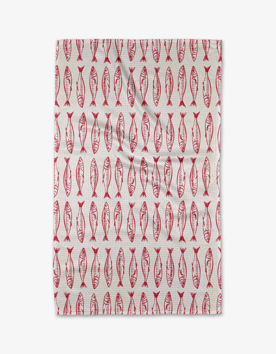 Tea towel with red fish pattern on a white background