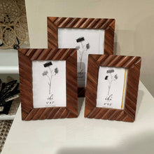 Load image into Gallery viewer, Three wooden picture frames with white backgrounds on a surface.
