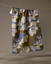 Load image into Gallery viewer, Floral patterned fabric hanging on a line against a brown background
