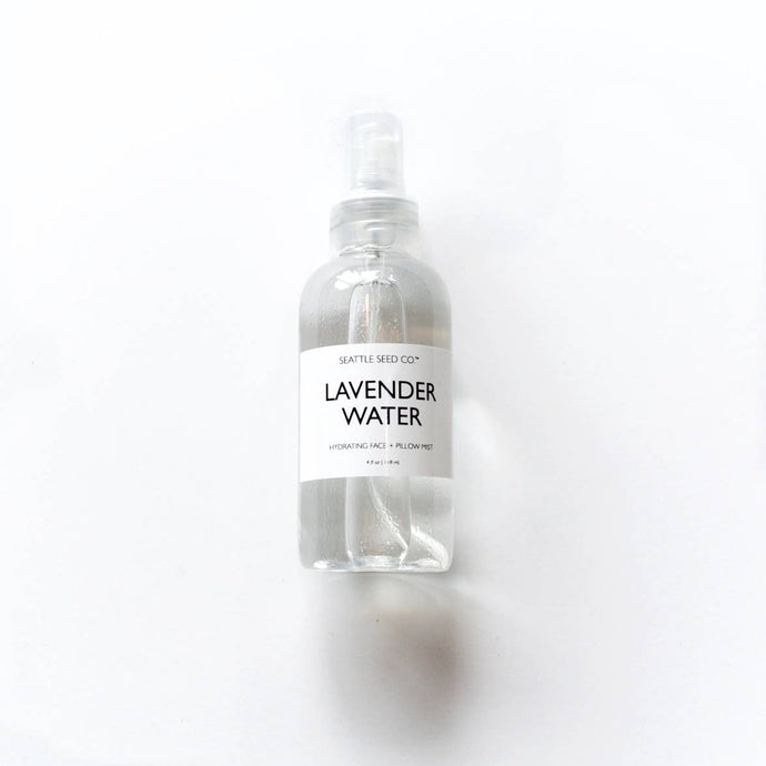 Bottle of lavendar water on a white background