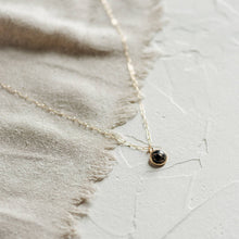 Load image into Gallery viewer, 8mm copper obsidian stone set in a bezel with a thick 24K gold deposition. It is suspended from an 18-inch paperclip chain
