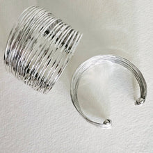 Load image into Gallery viewer, 2 Multi strand silver cuff bracelets on a white textyured background
