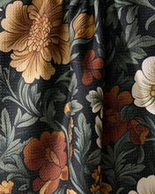 Load image into Gallery viewer, Close-up of floral fabric with large flowers on a dark background
