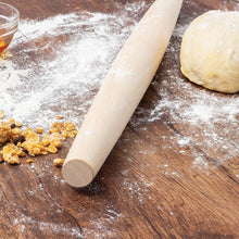 Load image into Gallery viewer, Rolling pin on a wooden surface with flour and dough
