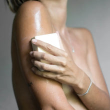 Load image into Gallery viewer, Person washing with bar soap to their arm with a white block
