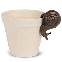 Load image into Gallery viewer, Beige ceramic pot with a bronze snail on a white background
