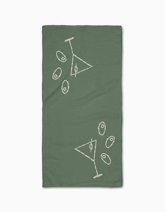 Green towel with white geometric designs on a white background