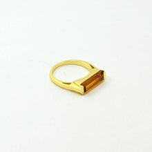 Load image into Gallery viewer, Gold ring with a rectangular brown gemstone on a white background
