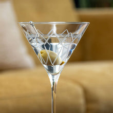 Load image into Gallery viewer, Clear martini glass with olives on a blurred background
