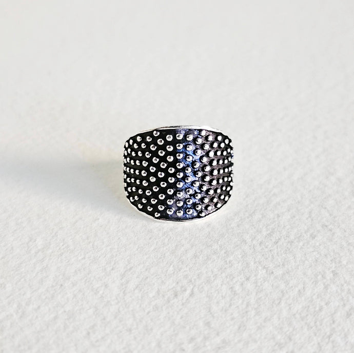 Silver ring on a white background