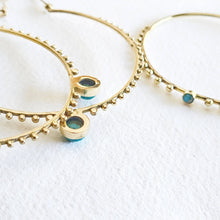 Load image into Gallery viewer, Gold hoop earrings with blue gemstones o
