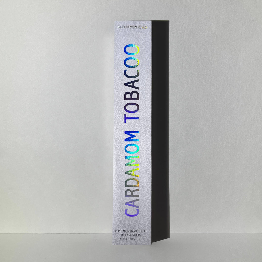 Cardamom Tobacco incense packaged in a white box with iridescent letters.
