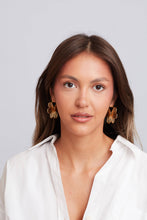 Load image into Gallery viewer, Woman wearing a white shirt with a plain background
