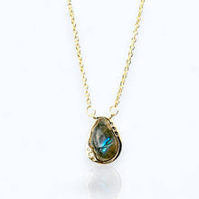 Load image into Gallery viewer, Green stone pendant on a black cord against a white background
