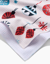 Load image into Gallery viewer, Close-up of a textured fabric with colorful decorative elements on a white background
