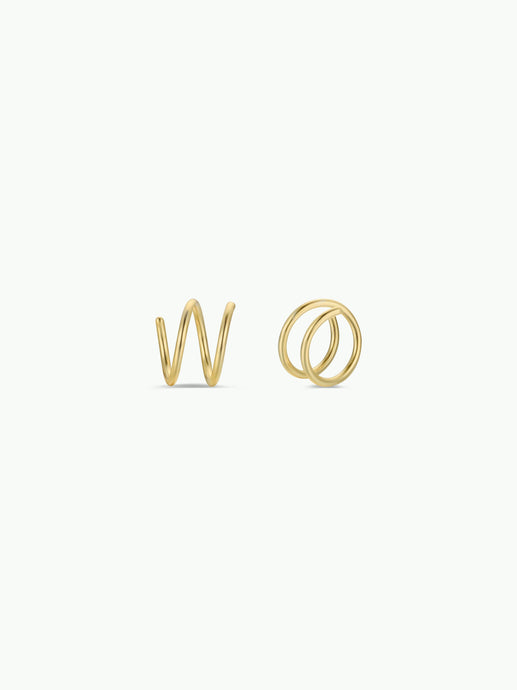 Gold spiral earrings on a white background