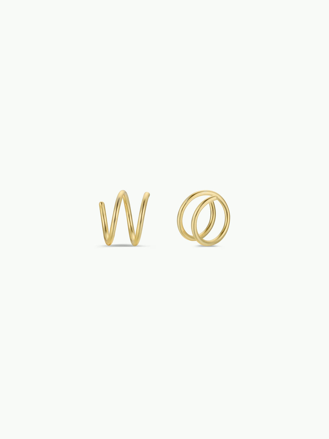 Gold spiral earrings on a white background