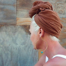 Load image into Gallery viewer, gold hoop earring with a turquoise stone 
