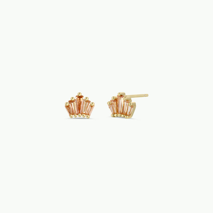 Gold crown-shaped earrings on a white background
