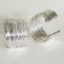 Load image into Gallery viewer, 2 Multi strand silver cuff bracelets on a textured white background
