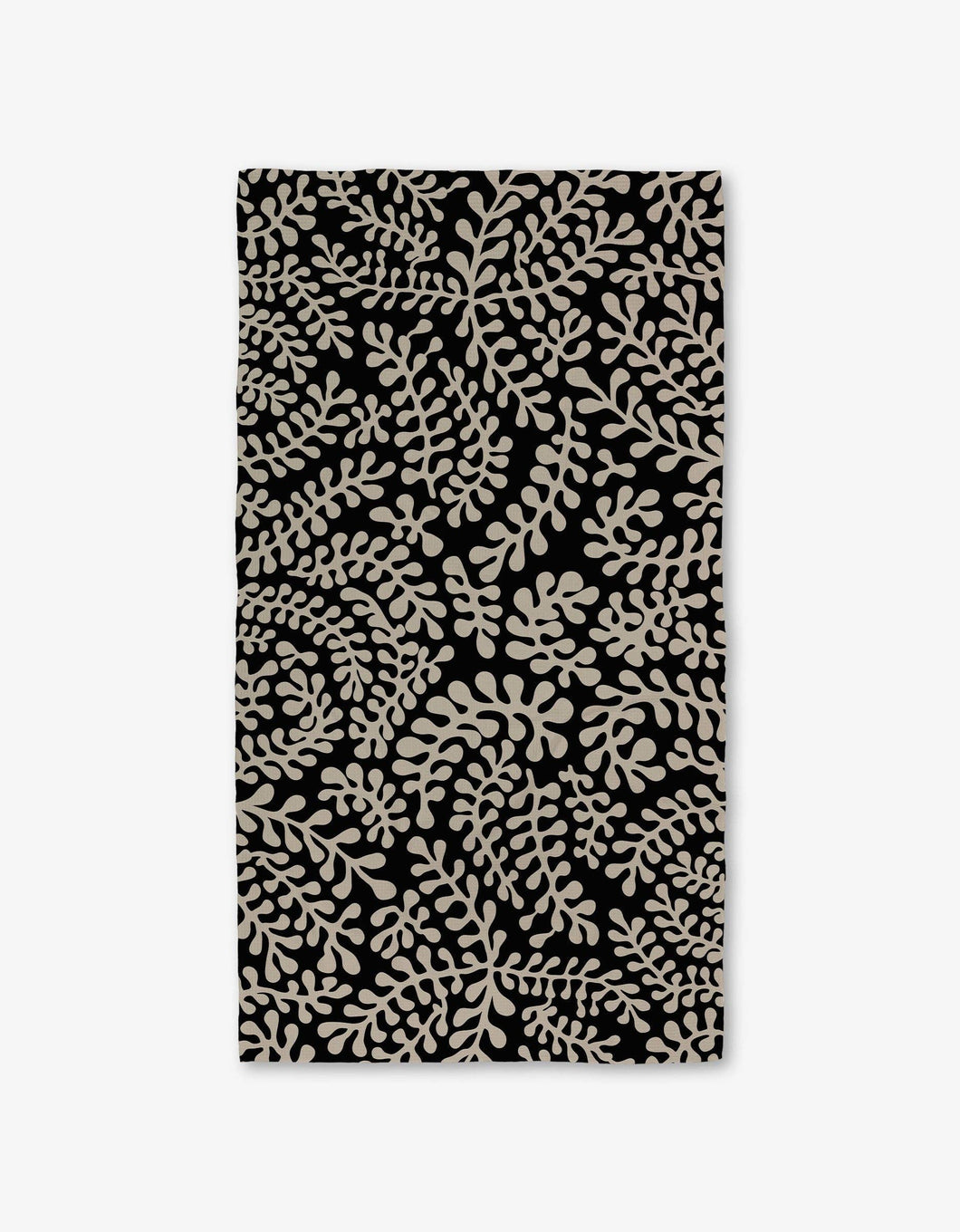 Black towel with beige leaf pattern on a white background
