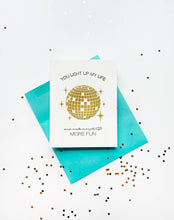 Load image into Gallery viewer, Greeting card with disco ball design and teal envelope on a white background with confetti.
