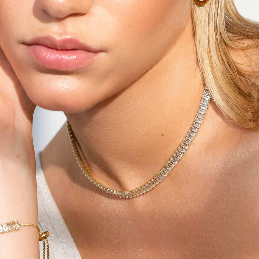 Woman wearing a baguette tennis necklace