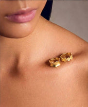 Load image into Gallery viewer, Gold earring on a person's earlobe against a neutral background
