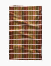 Load image into Gallery viewer, Plaid towel with autumnal colors on a white background
