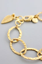 Load image into Gallery viewer, Gold chain bracelet with a leaf charm
