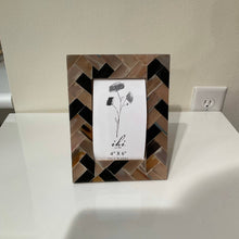 Load image into Gallery viewer, Decorative picture frame with a geometric chevron pattern
