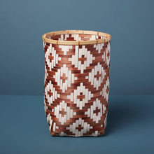 Load image into Gallery viewer, Woven basket with geometric pattern on a blue background
