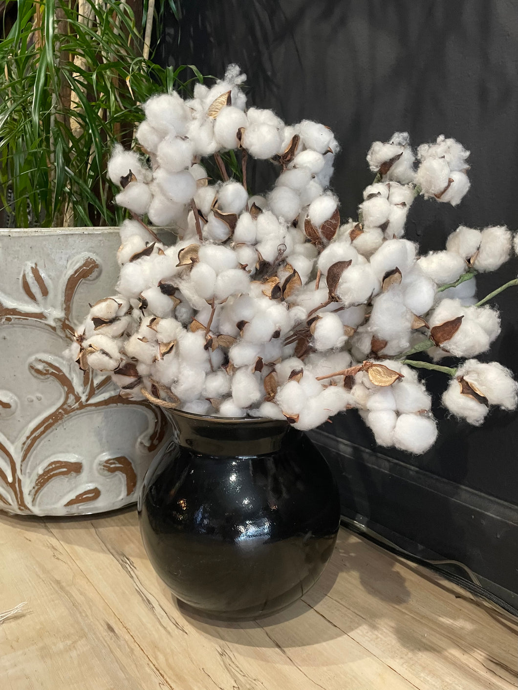 Black stoneware Chenna vase styled with faux cotton branches