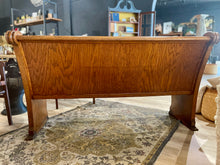 Load image into Gallery viewer, Rear view of a wooden church pew in a room with a rug and furniture.
