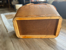 Load image into Gallery viewer, Woven basket with a textured lid on a wooden surface
