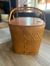 Load image into Gallery viewer, Woven picnic basket on a wooden surface with a blurred background
