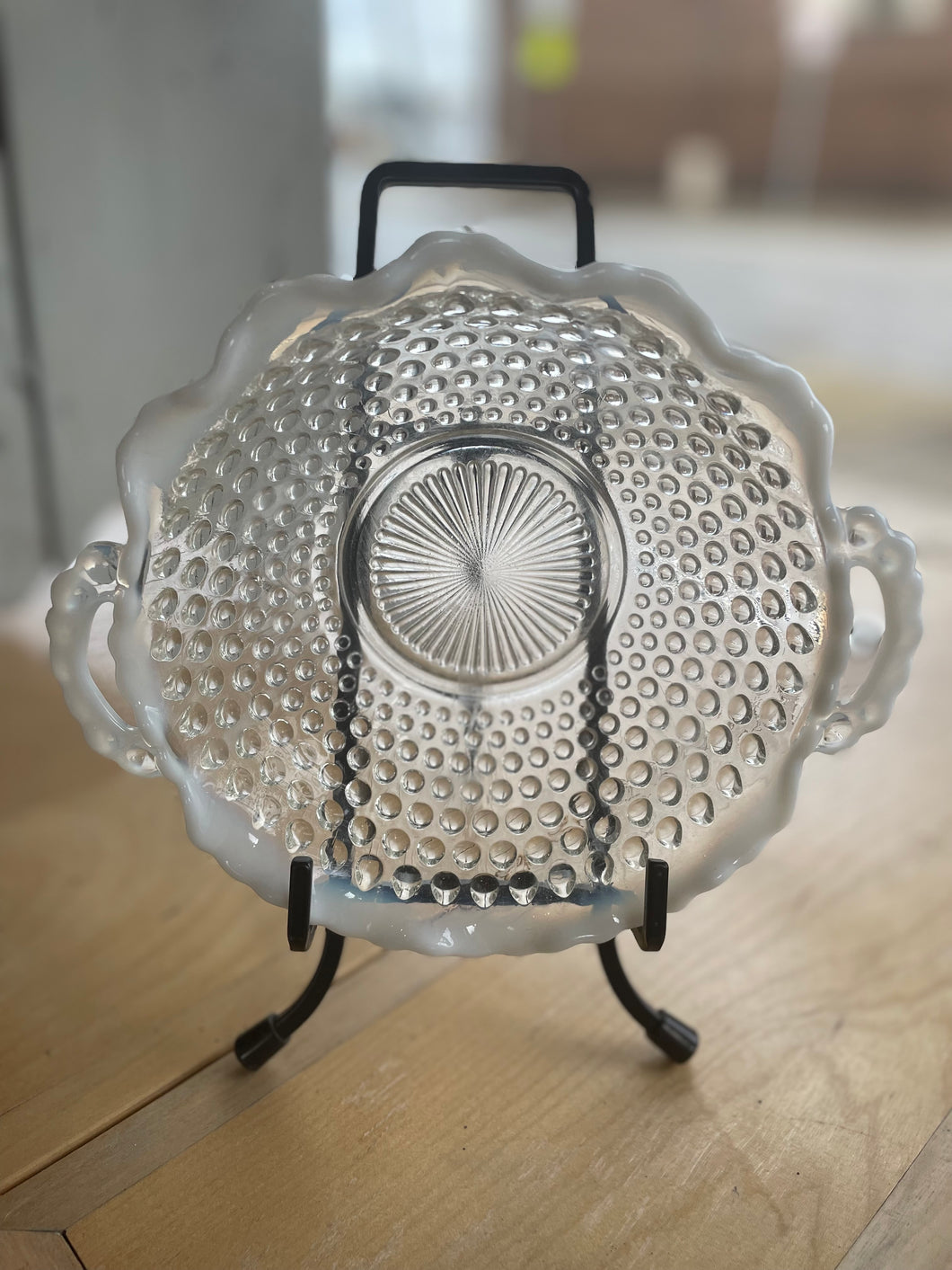 Clear glass dish with textured design on a wooden surface