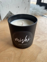 Load image into Gallery viewer, Black candle container with 'mishi' branding on a wooden surface
