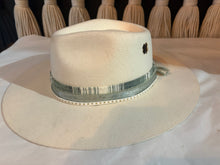 Load image into Gallery viewer, Beige cowboy hat with a band on a white surface
