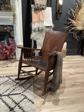 Load image into Gallery viewer, Wooden chair with decorative elements on a patterned rug
