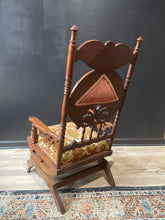 Load image into Gallery viewer, Wooden chair with intricate carvings on a patterned rug
