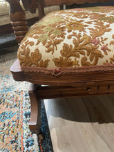 Load image into Gallery viewer, Close-up of a wooden chair with patterned fabric seat on a wooden floor.
