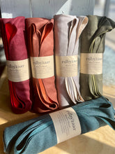 Load image into Gallery viewer, Five rolled-up towels in various colors with 'rubyzaar' labels on a wooden surface.
