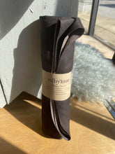 Load image into Gallery viewer, Dark gray scarf with a label on a wooden surface
