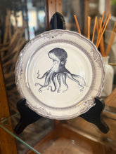 Load image into Gallery viewer, Octopus plate with Silver Detail on a glass shelf with a mirror background
