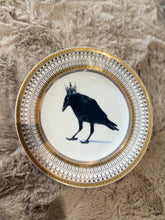Load image into Gallery viewer, Crowned Gold plate with Crow design on a tan background
