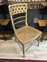 Load image into Gallery viewer, Caned chairs with sculptural cutout back

