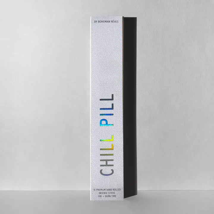 Chill Pill incense packaged in a white box with iridescent letters.